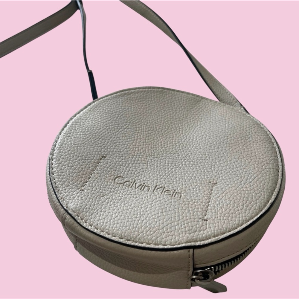Calvin Klein Round Pebbled Leather Crossbody in Taupe